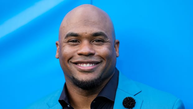 Former Panthers wide receiver and current commentator Steve Smith Sr. smiles before a game between Carolina and the Ravens.